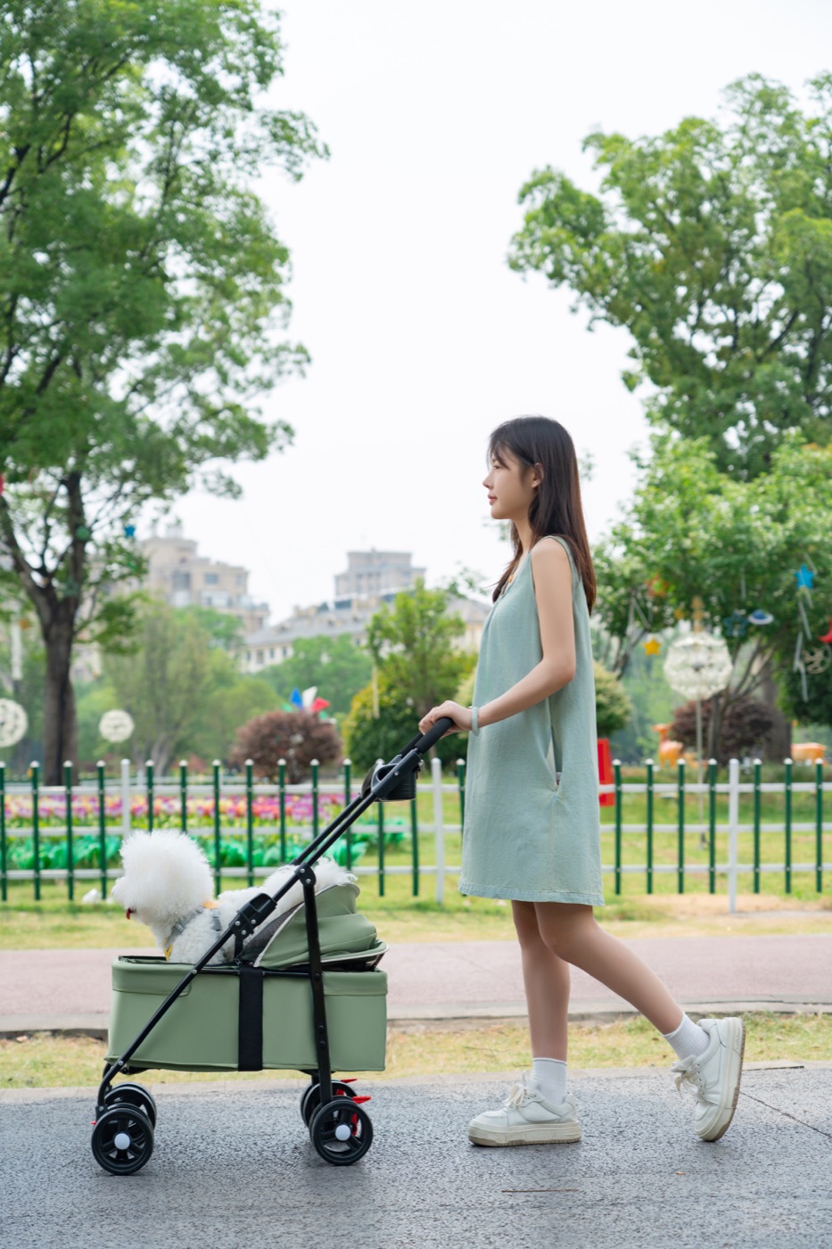 Green four-wheel pet stroller